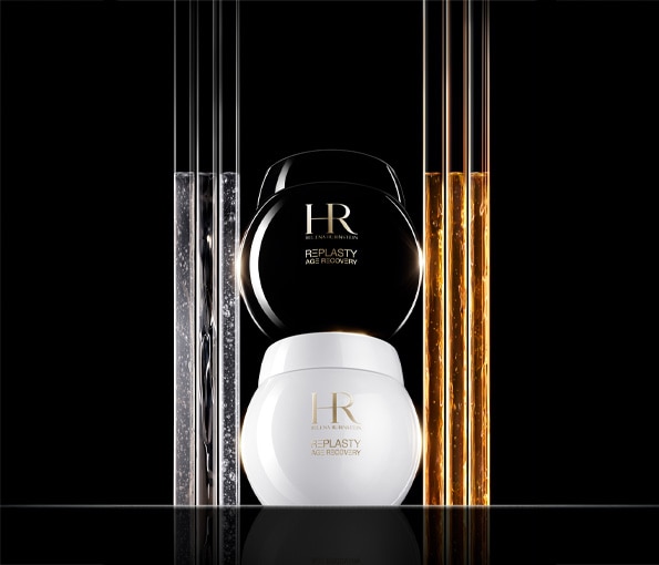 Helena Rubinstein Replasty Age Recovery – luxusný denný a nočný krém v čiernom a bielom flakóne na elegantnom čiernom pozadí.